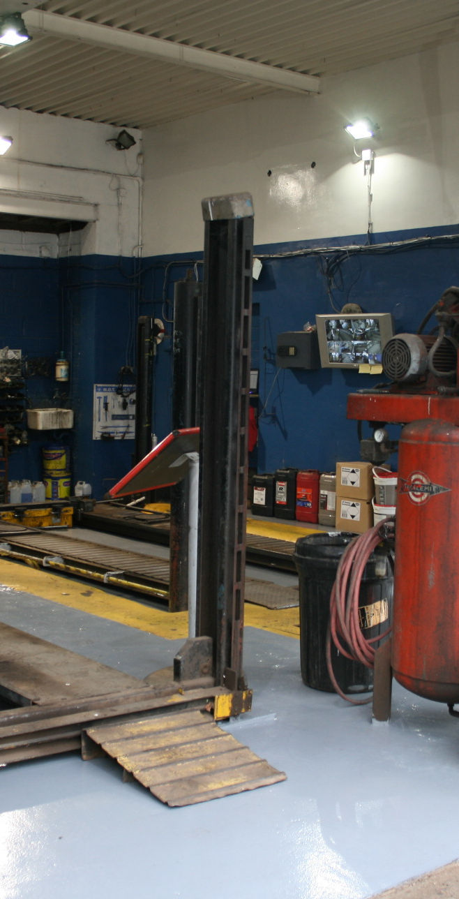 Inside the Sun Motors workshop, vehicle lift and tools